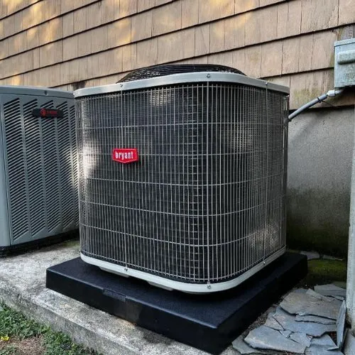 bryant ac condenser after intsall with house with tan siding