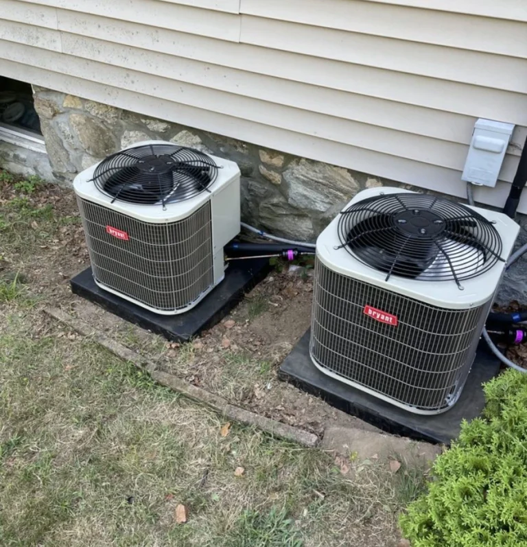 two ac units outside side of home