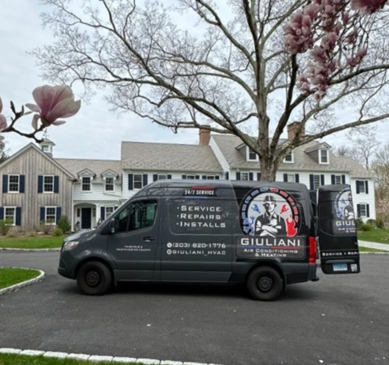 boiler repair van for giuliani hvac parked in front of greenwich ct home